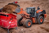 New Hitachi Loader dumping dirt